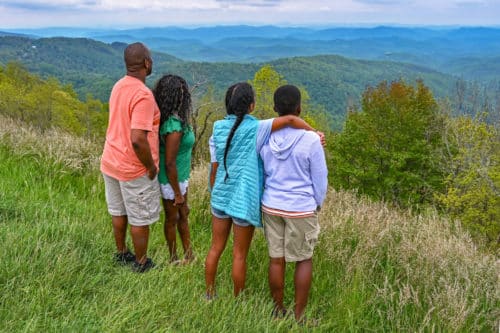 family overlooking thunder hill, part of the mountains to sea trail