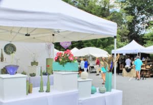 Photo of booths and people shopping at the Blowing Rock Art in the Park event.