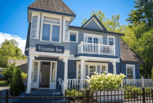 Cozy, blue and white inn with Victorian architectural details