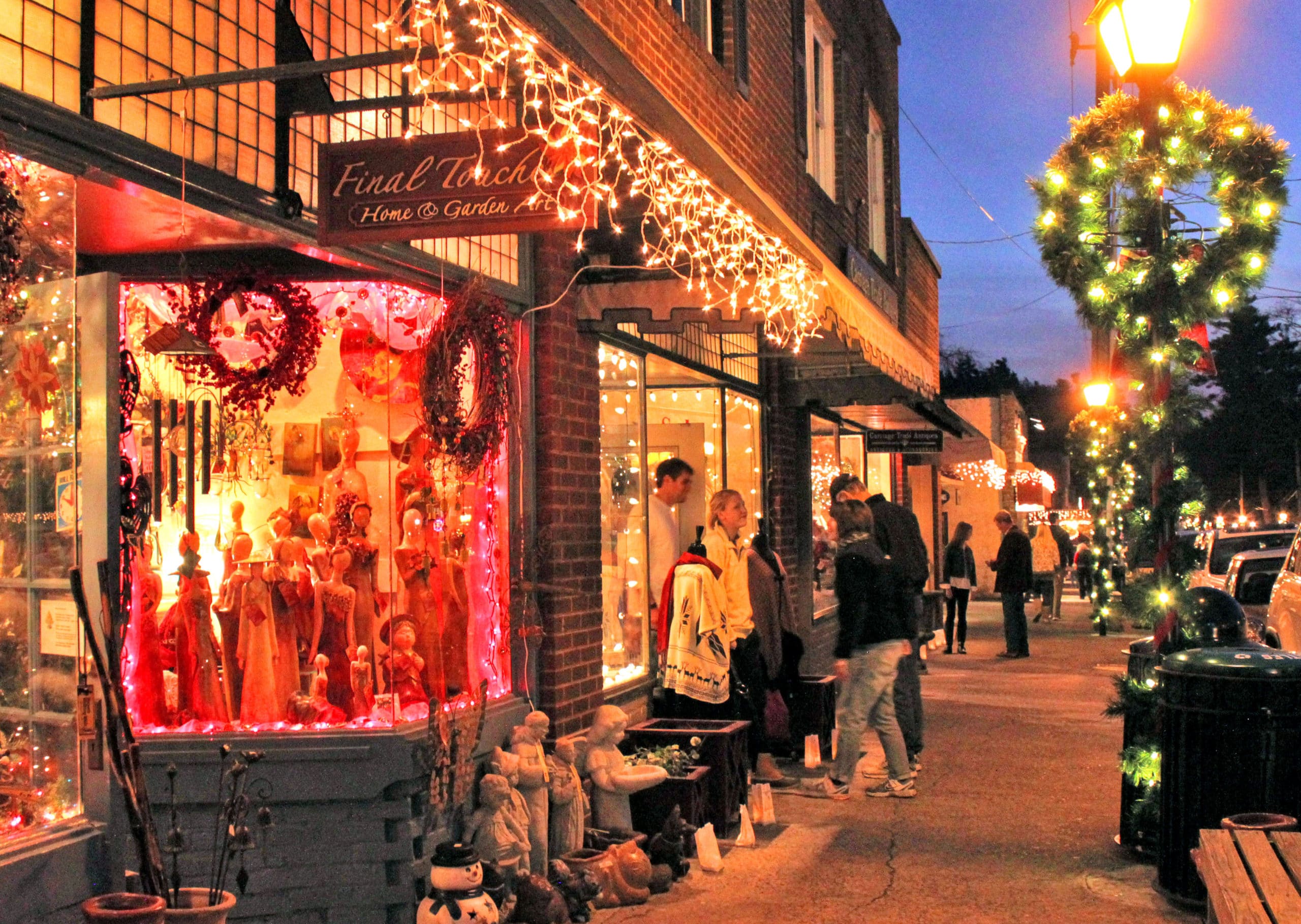 Blowing Rock downtown storefronts are lit up for holiday shopping.